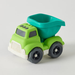 Green toy dump truck on a light gray background