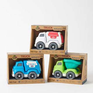 Three toy trucks in cardboard boxes on a white background