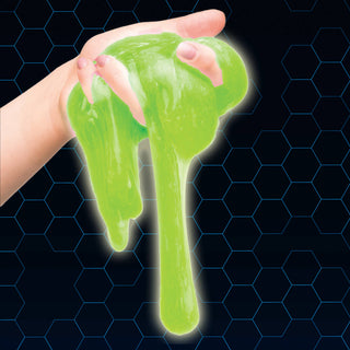 Green slime being stretched between two hands against a dark background with a hexagonal pattern.