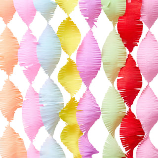 Colorful paper fan pattern on a white background
